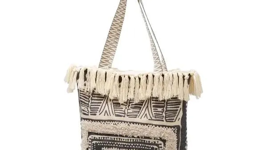 Close-up of stitched handle attachment on a custom canvas tote bag